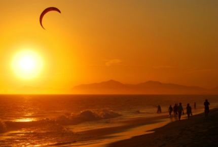 A paraglider enjoys the sunset in Rio de Janeiro