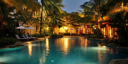 Romantically lit pool at Settha Palace Hotel