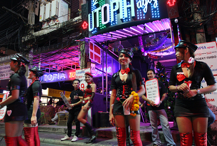 Women trying to entice customers into Utopia in Patpong, Bangkok