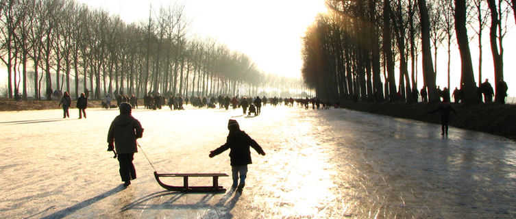 Ice-skating on Bruges' canal, Belgium