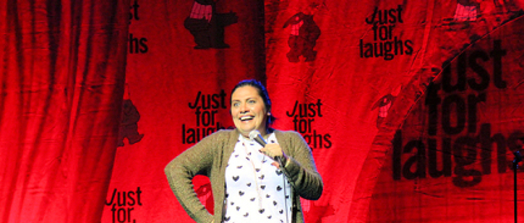 A comic shares a joke at Just For Laughs in Canada