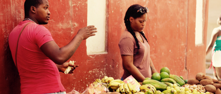 Habaneros selling fresh produce at a street market