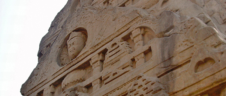 Masroor's carving of a deity looks remarkably like the Buddha
