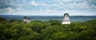 The lost city of Tikal punctuates the jungle canopy in Guatemala