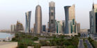 The bustling city of Doha nestled against the Persian Gulf