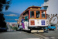 Cable car with visitors © San Francisco Convention & Visitors Bureau, photo by Phillip H Coblentz