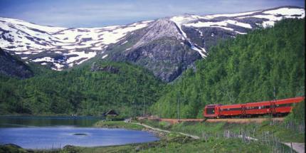 Snow-capped peaks on Norway's Bergensbanen rail trip © Rune Fossum