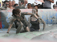 Take part in mud wrestling