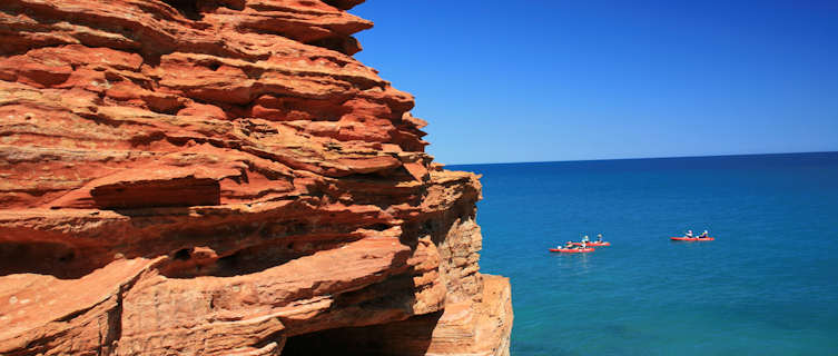 Coanoeing off the red cliffs of West Australia