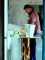 A cook prepares the onboard meal in the train pantry