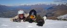 Snowboarders atop Coronet Peak